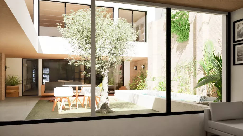 Vista de patio central y piscina desde habitación en Vivienda de consumo casi nulo en Valencia