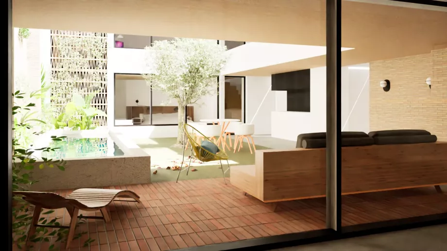 Vista del patio interior y piscina desde el salón de bajo industrial reformado en vivienda pasiva en valencia